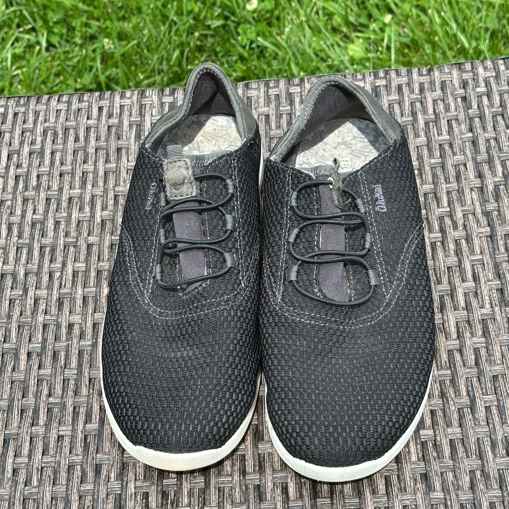 OluKai Black Sneakers with Breathable Mesh and Slip-On Design
